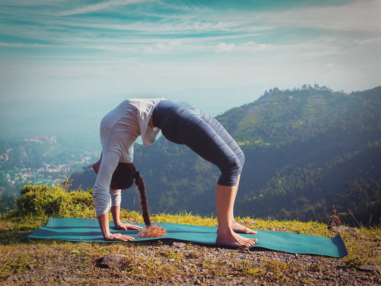 Woman Doing Ashtanga Vinyasa Yoga Asana Urdhva Dhanurasana